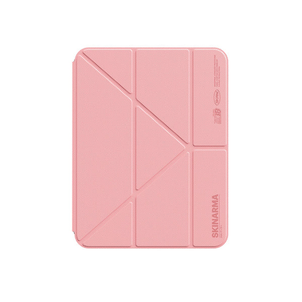 A pink textured tablet case with a foldable geometric design, featuring the SKINARMA brand name printed vertically on the bottom right, shown on a solid white background.